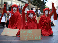 Red Rebels in front of the sit-in. Extinction Rebellion (XR) Toulouse organized a sit-in of women in one of the most frequented street of To...