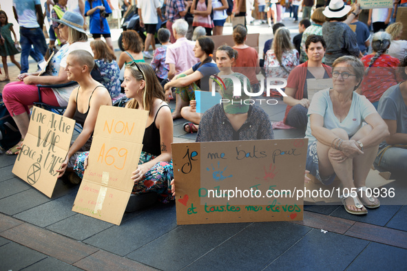 A woman holds a placard reading 'I fight for my O., 7yo, J., 5yo and all my pupils'. Extinction Rebellion (XR) Toulouse organized a sit-in o...