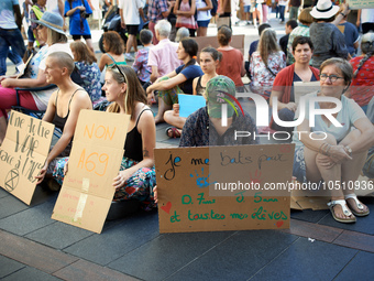 A woman holds a placard reading 'I fight for my O., 7yo, J., 5yo and all my pupils'. Extinction Rebellion (XR) Toulouse organized a sit-in o...