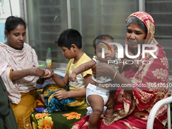 Patients suffering from dengue fever are being treated inside the Mugdha General Hospital's admission section in Dhaka, Bangladesh on Septem...