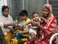 Patients suffering from dengue fever are being treated inside the Mugdha General Hospital's admission section in Dhaka, Bangladesh on Septem...