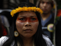 An indigenous person marches among thousands representing various groups participate in the ''End of Fossil Fuels'' protest across Midtown M...