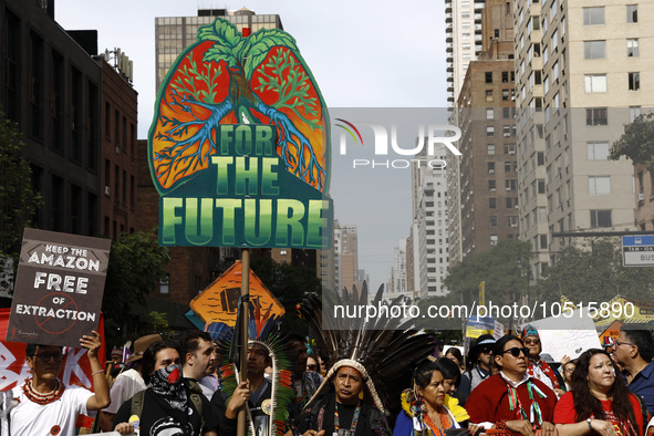 Indigenous people march among thousands representing various groups that participate in the ''End of Fossil Fuels'' protest across Midtown M...