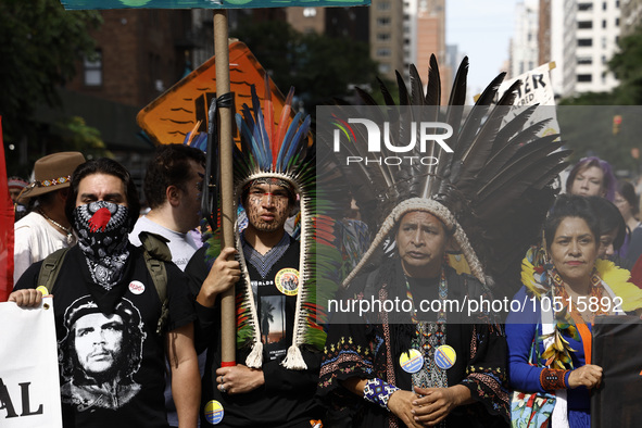 Indigenous people march among thousands representing various groups that participate in the ''End of Fossil Fuels'' protest across Midtown M...