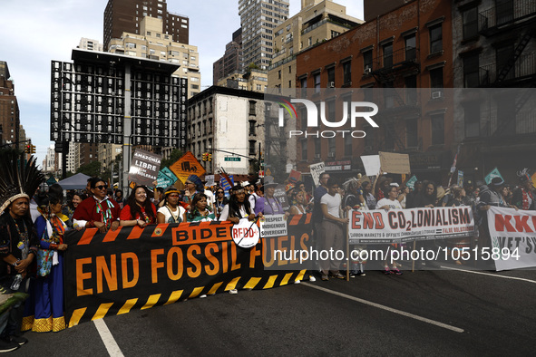 Indigenous people march among thousands representing various groups that participate in the ''End of Fossil Fuels'' protest across Midtown M...