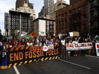 Indigenous people march among thousands representing various groups that participate in the ''End of Fossil Fuels'' protest across Midtown M...