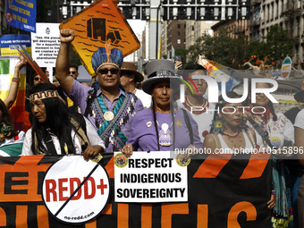 Indigenous people march among thousands representing various groups that participate in the ''End of Fossil Fuels'' protest across Midtown M...