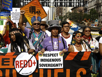 Indigenous people march among thousands representing various groups that participate in the ''End of Fossil Fuels'' protest across Midtown M...