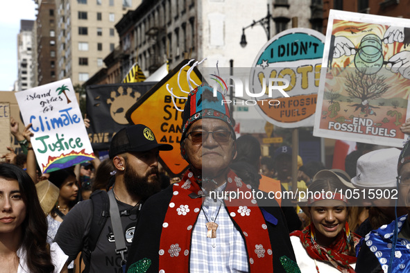 Indigenous people march among thousands representing various groups that participate in the ''End of Fossil Fuels'' protest across Midtown M...