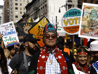 Indigenous people march among thousands representing various groups that participate in the ''End of Fossil Fuels'' protest across Midtown M...