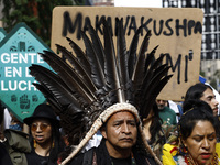 Indigenous people march among thousands representing various groups that participate in the ''End of Fossil Fuels'' protest across Midtown M...