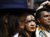 Indigenous people march among thousands representing various groups that participate in the ''End of Fossil Fuels'' protest across Midtown M...