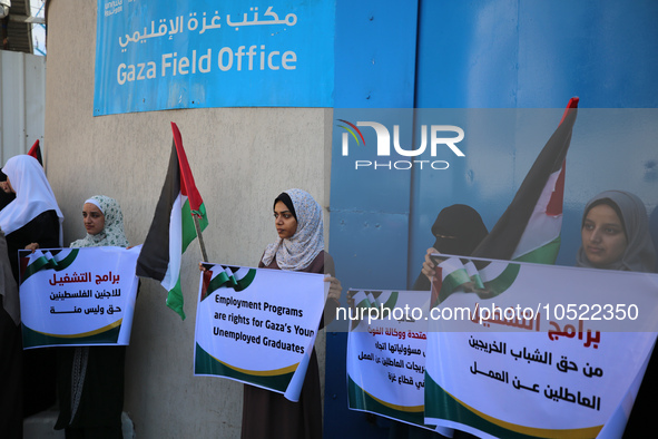 Demonstrators gather outside the Gaza Field Office for the United Nations Relief Works Agency for Palestine Refugees in the Near East (UNRWA...