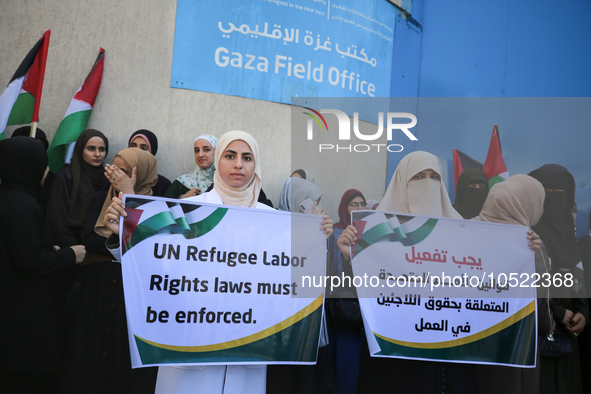 Demonstrators gather outside the Gaza Field Office for the United Nations Relief Works Agency for Palestine Refugees in the Near East (UNRWA...