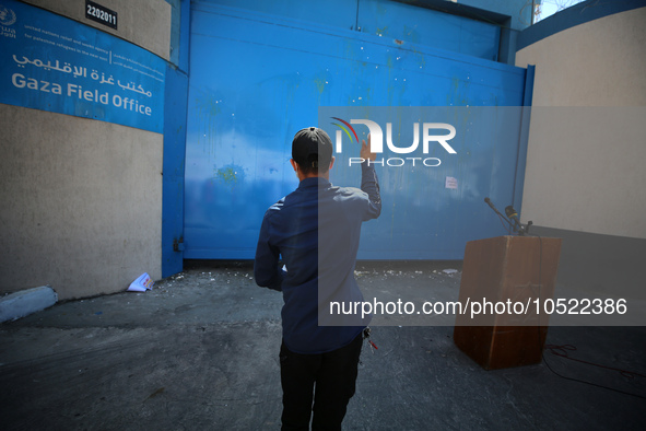 Palestinian protesters throw eggs at the entrance of the Gaza City headquarters of the United Nations Relief and Works Agency for Palestine...