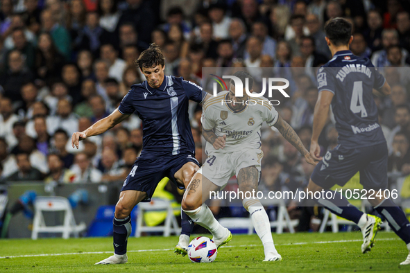 
Robin Le Normand of Real Sociedad in action with Joselu of Real Madrid during the LaLiga EA Sports match between Real Madrid  and Real Soci...