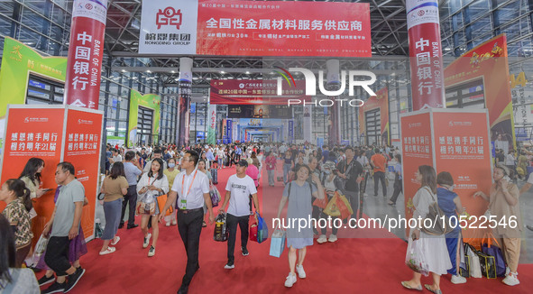 NANNING, CHINA - SEPTEMBER 19, 2023 - People walk out of the venue of the ASEAN Expo with purchased goods in Nanning, Guangxi province, Chin...