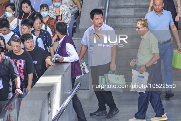 NANNING, CHINA - SEPTEMBER 19, 2023 - People walk out of the venue of the ASEAN Expo with purchased goods in Nanning, Guangxi province, Chin...