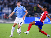 Adam Marusic of SS Lazio and Samuel Lino of Atletico de Madrid compete for the ball during the UEFA Champions League Group E match between S...