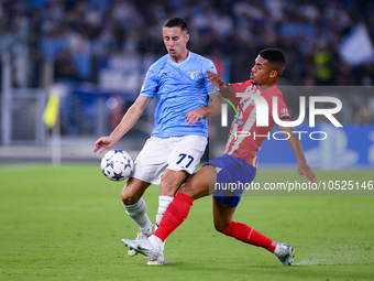 Adam Marusic of SS Lazio and Samuel Lino of Atletico de Madrid compete for the ball during the UEFA Champions League Group E match between S...