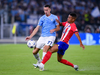 Adam Marusic of SS Lazio and Samuel Lino of Atletico de Madrid compete for the ball during the UEFA Champions League Group E match between S...