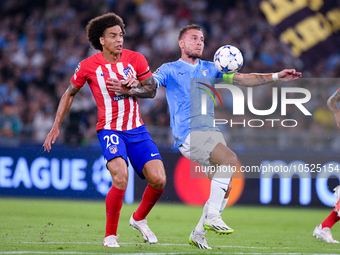 Axel Witsel of Atletico de Madrid and Ciro Immobile of SS Lazio compete for the ball during the UEFA Champions League Group E match between...