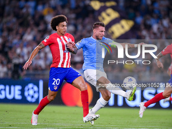 Axel Witsel of Atletico de Madrid and Ciro Immobile of SS Lazio compete for the ball during the UEFA Champions League Group E match between...