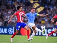 Axel Witsel of Atletico de Madrid and Ciro Immobile of SS Lazio compete for the ball during the UEFA Champions League Group E match between...