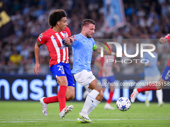 Axel Witsel of Atletico de Madrid and Ciro Immobile of SS Lazio compete for the ball during the UEFA Champions League Group E match between...