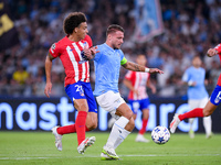 Axel Witsel of Atletico de Madrid and Ciro Immobile of SS Lazio compete for the ball during the UEFA Champions League Group E match between...