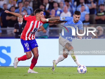 Mattia Zaccagni of SS Lazio and Nahuel Molina of Atletico de Madrid compete for the ball during the UEFA Champions League Group E match betw...