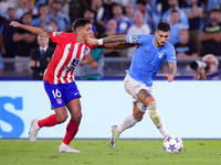 Mattia Zaccagni of SS Lazio and Nahuel Molina of Atletico de Madrid compete for the ball during the UEFA Champions League Group E match betw...