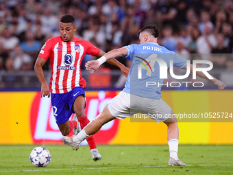 Samuel Lino of Atletico de Madrid and Gil Patric of SS Lazio compete for the ball during the UEFA Champions League Group E match between SS...