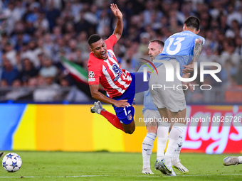 Samuel Lino of Atletico de Madrid and Gil Patric of SS Lazio compete for the ball during the UEFA Champions League Group E match between SS...