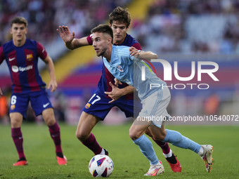 Oscar Mingueza right-back of Celta de Vigo and Spain and Marcos Alonso left-back of Barcelona and Spaincompete for the ball during the LaLig...