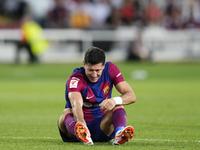 Robert Lewandowski centre-forward of Barcelona and Poland lies injured on the pitch during the LaLiga EA Sports match between FC Barcelona a...