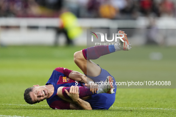 Robert Lewandowski centre-forward of Barcelona and Poland lies injured on the pitch during the LaLiga EA Sports match between FC Barcelona a...