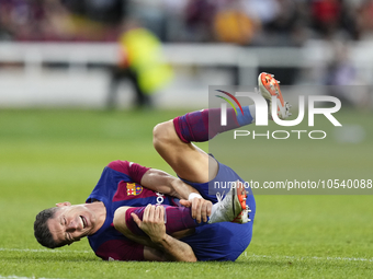 Robert Lewandowski centre-forward of Barcelona and Poland lies injured on the pitch during the LaLiga EA Sports match between FC Barcelona a...