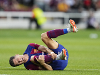 Robert Lewandowski centre-forward of Barcelona and Poland lies injured on the pitch during the LaLiga EA Sports match between FC Barcelona a...