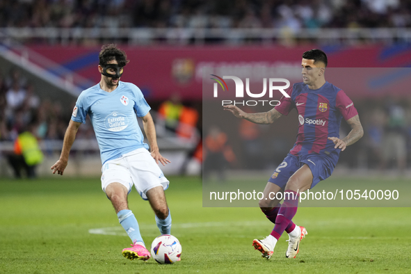 Luca de la Torre central midfield of Celta de Vigo and United States and Joao Cancelo right-back of Barcelona and Portugal compete for the b...