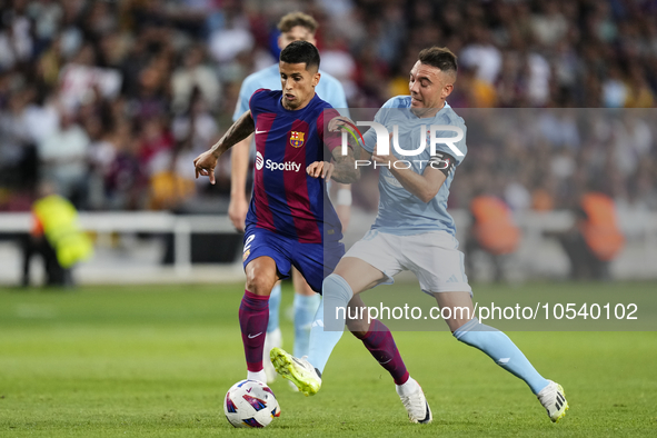 Joao Cancelo right-back of Barcelona and Portugal and Iago Aspas centre-forward of Celta de Vigo and Spain compete for the ball during the L...