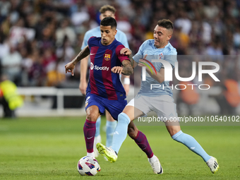 Joao Cancelo right-back of Barcelona and Portugal and Iago Aspas centre-forward of Celta de Vigo and Spain compete for the ball during the L...