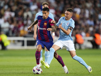 Joao Cancelo right-back of Barcelona and Portugal and Iago Aspas centre-forward of Celta de Vigo and Spain compete for the ball during the L...