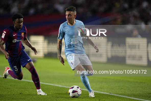 Iago Aspas centre-forward of Celta de Vigo and Spain and Alejandro Balde left-back of Barcelona and Spain compete for the ball during the La...