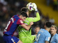 Robert Lewandowski centre-forward of Barcelona and Poland and Ivan Villar goalkeeper of Celta de Vigo and Spain compete for the ball during...