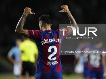 Joao Cancelo right-back of Barcelona and Portugal celebrates after scoring his sides first goal during the LaLiga EA Sports match between FC...