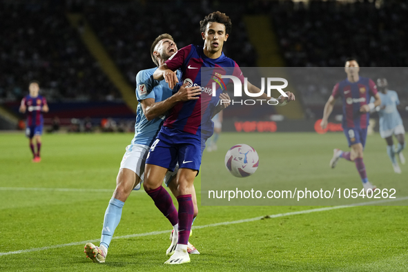 Ferran Torres left winger of Barcelona and Spain and Unai Nuñez centre-Back of Celta de Vigo and Spain compete for the ball during the LaLig...