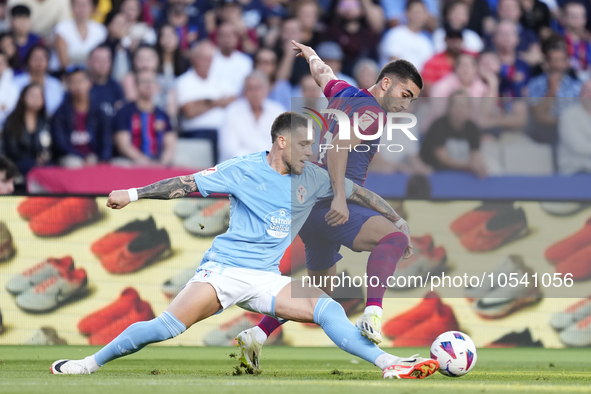 Ferran Torres left winger of Barcelona and Spain and Mihailo Ristic left-Back of Celta de Vigo and Serbia compete for the ball during the La...