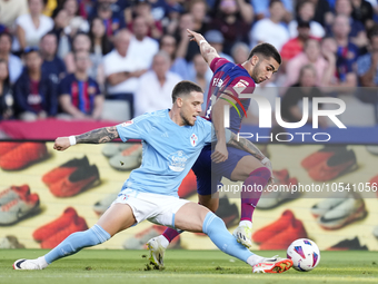 Ferran Torres left winger of Barcelona and Spain and Mihailo Ristic left-Back of Celta de Vigo and Serbia compete for the ball during the La...