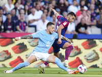 Ferran Torres left winger of Barcelona and Spain and Mihailo Ristic left-Back of Celta de Vigo and Serbia compete for the ball during the La...